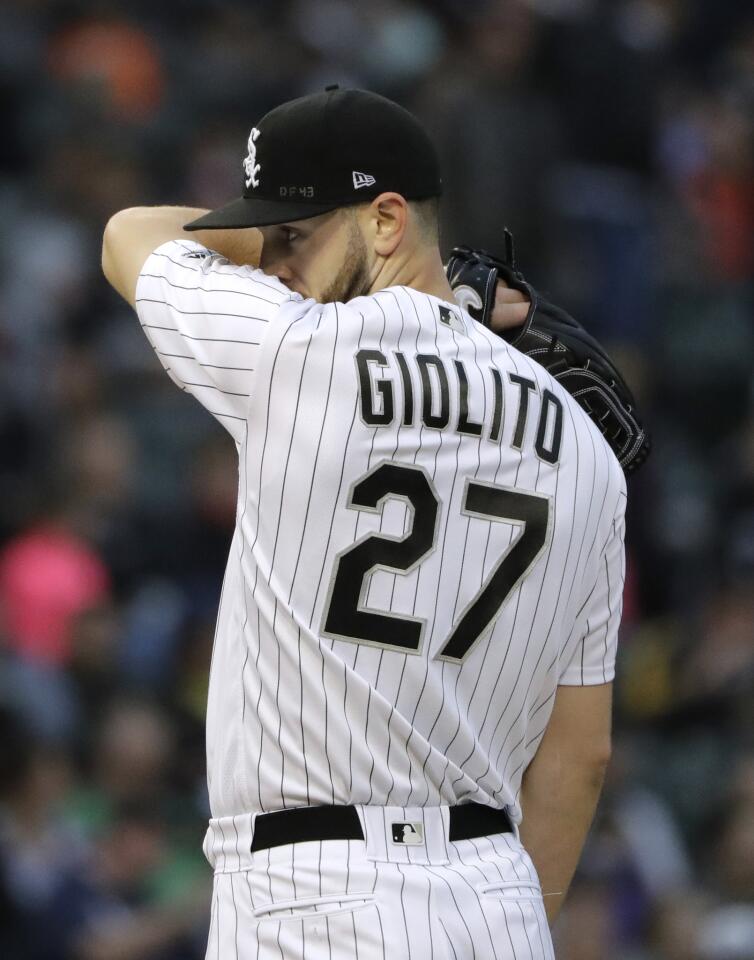 White Sox starter Lucas Giolito wipes his face during the third inning against the Rangers at Guaranteed Rate Field on Saturday, May 19, 2018.