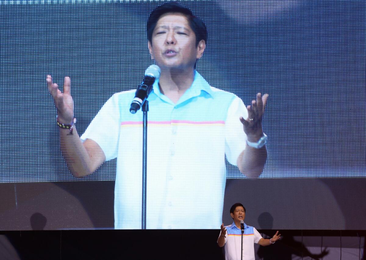 In this May 5 photo, vice presidential candidate Sen. Ferdinand "Bongbong" Marcos Jr. gestures during his last campaign rally for Monday's presidential elections in suburban Mandaluyong city, east of Manila.
