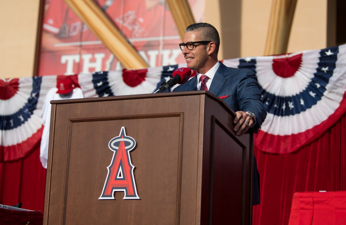 Angels broadcaster Victor Rojas speaks during a news conference.