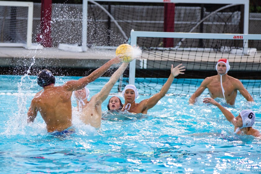 Zach Fales (left) of The Bishop's School shoots during Bishop's 10-5 water polo victory over La Jolla High School on May 28. 