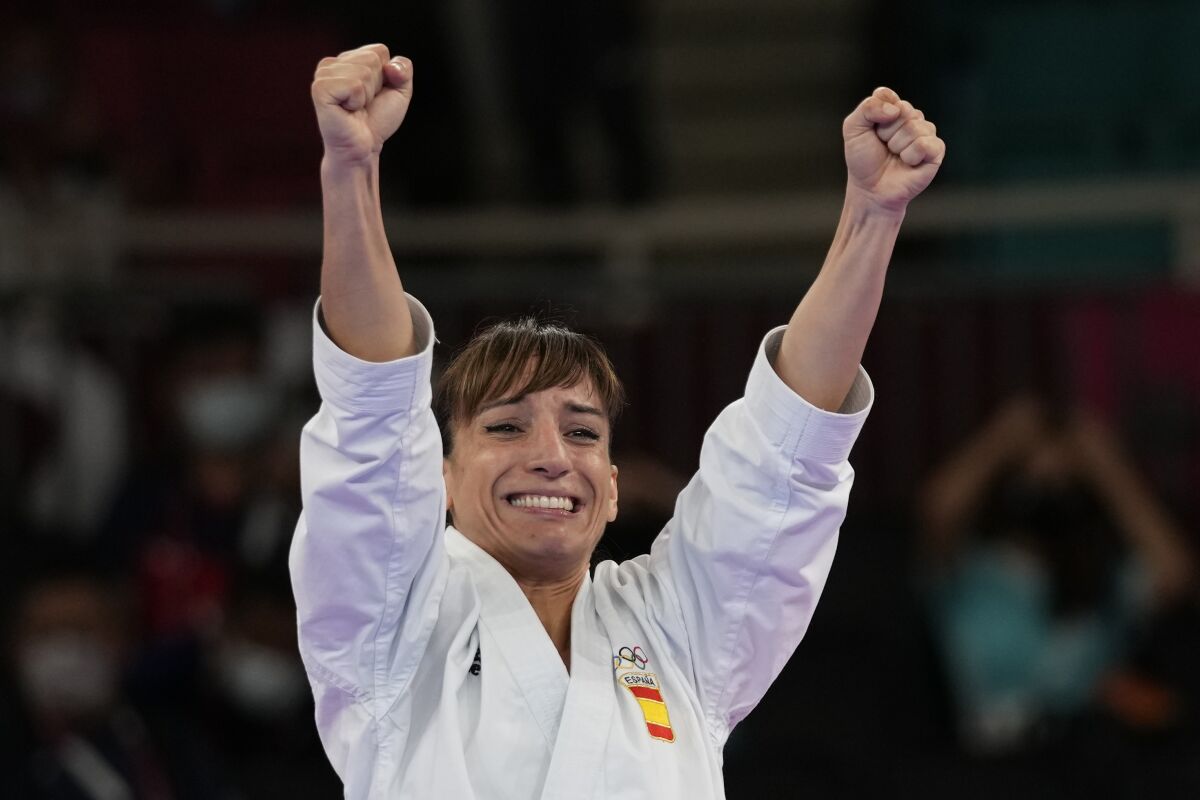Sandra Sanchez Jaime of Spain celebrates after winning the women's kata final bout for Karate at the 2020 Summer Olympics, Thursday, Aug. 5, 2021, in Tokyo, Japan. (AP Photo/Vincent Thian)
