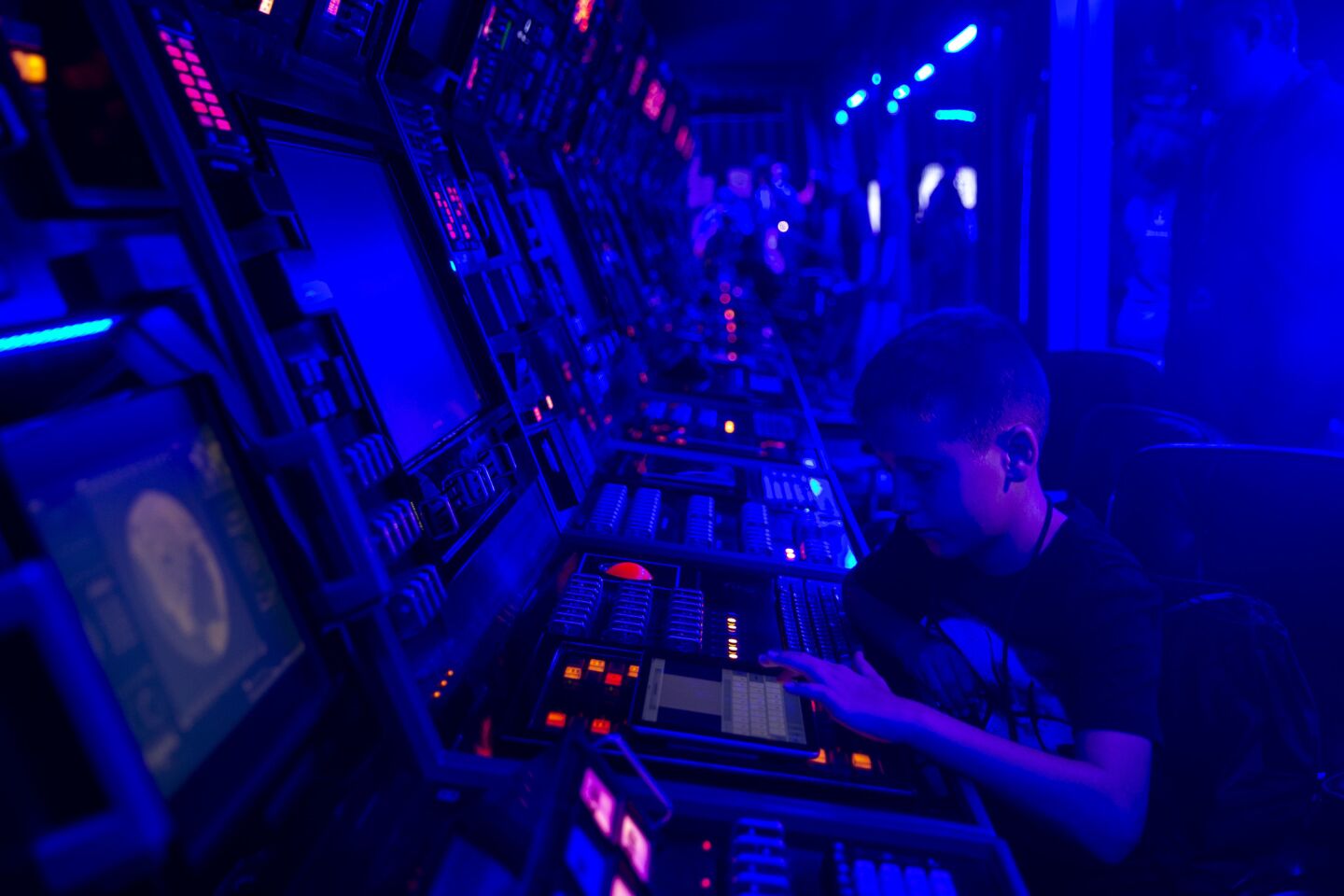 Austen Bue, 11, from San Diego sends a text message to space, at the Hsitory Channel's "Project Blue Book" activation site.