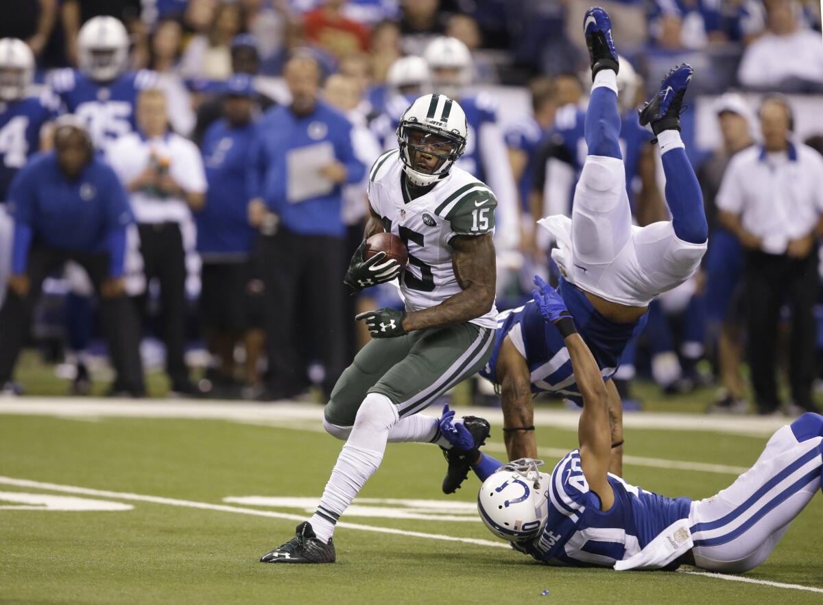 Jets receiver Brandon Marshall gets free of Colts cornerback Sheldon Price (40) and linebacker Jerrell Freeman (50) in the second half.