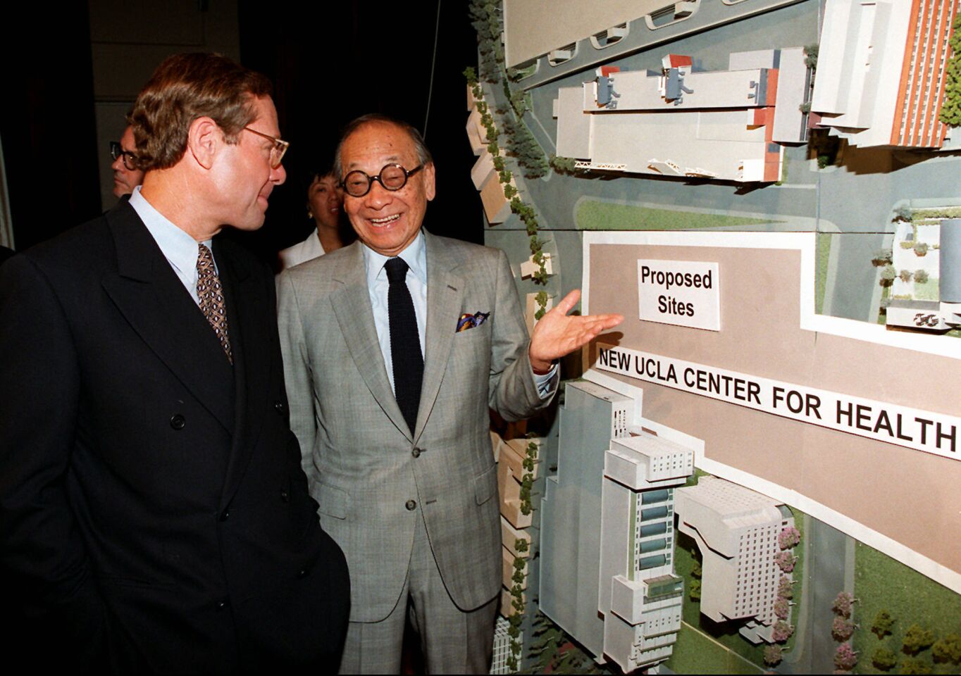 Architect I.M. Pei, right, chats with Michael Ovitz in front of a model of the the $1.1-billion Ronald Reagan UCLA Medical Center.