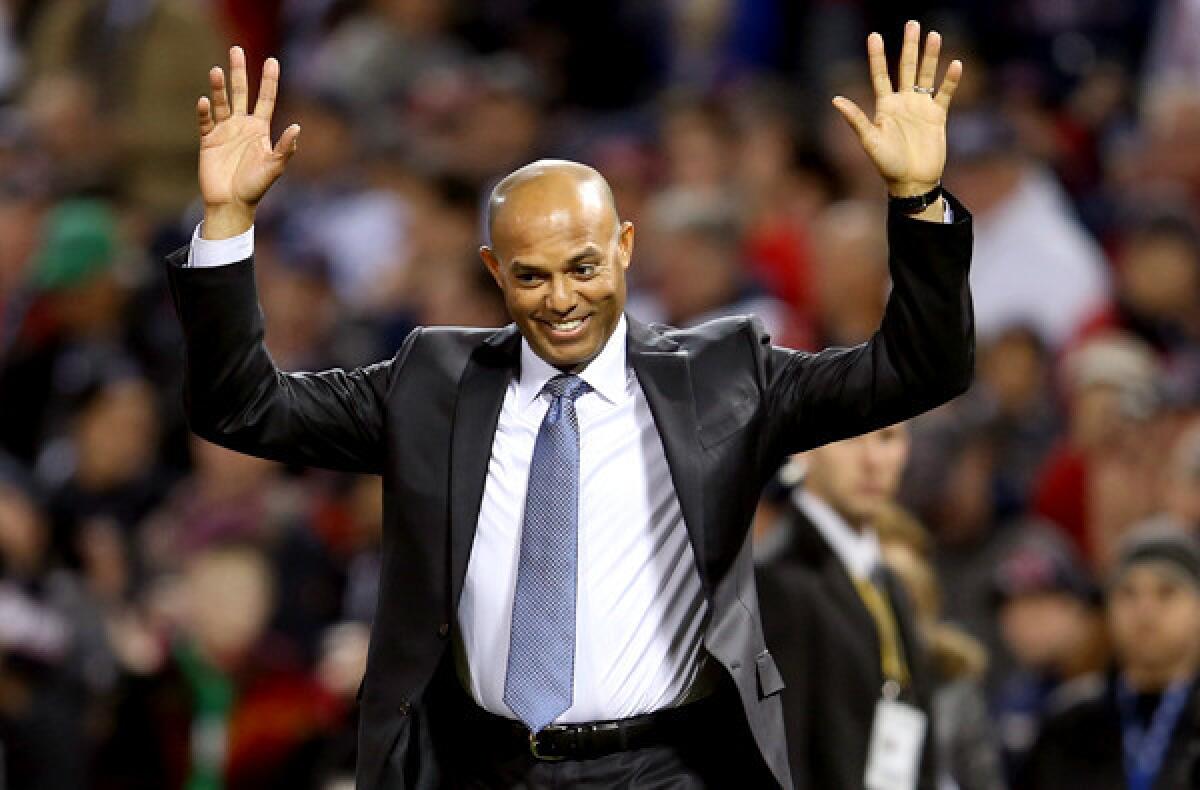 Former New York Yankees pitcher Mariano Rivera takes the field to be honored before Game 2 of the World Series on Thursday night at Boston's Fenway Park.