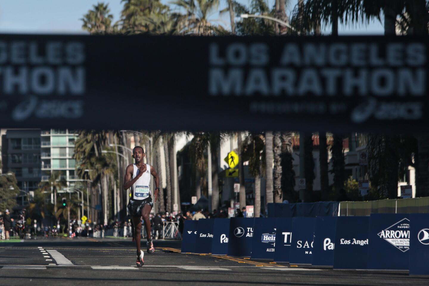 Bayelign Teshager, 19, of Ethiopia completes the 2020 Los Angeles Marathon on Sunday in Santa Monica.