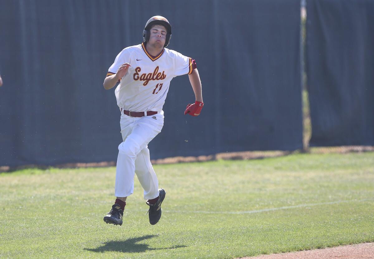 Estancia High's Justin Wood runs hard for home to complete an inside-the-park home run in the second inning of an Orange Coast League game against Saddleback on Wednesday.