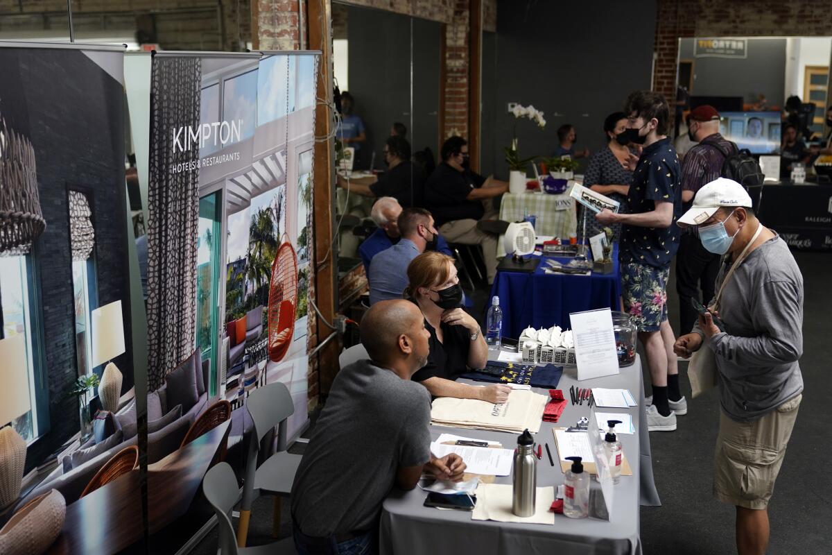 Employers and job seekers interact during a job fair