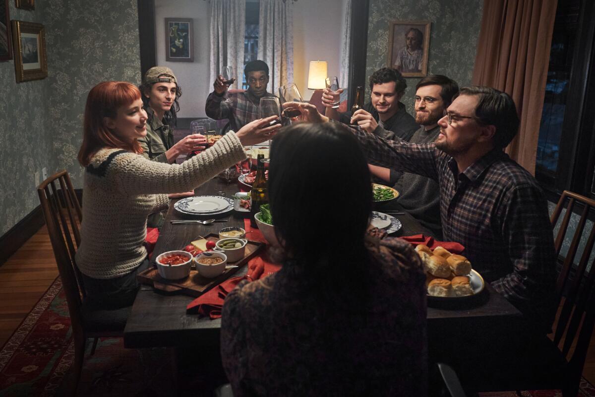 A scene of people toasting around a table from "Don't Look Up."