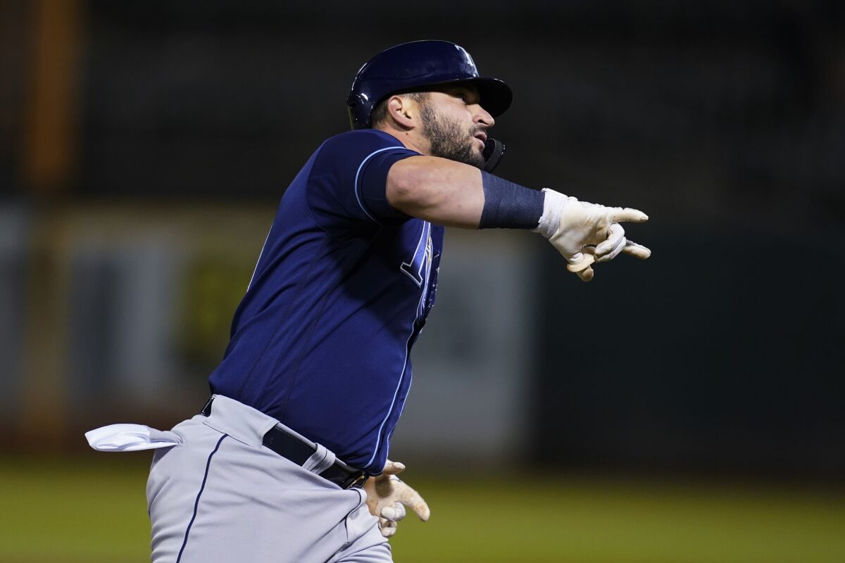 Tampa Bay Rays' Mike Zunino gestures after hitting a two-run home run against the Oakland Athletics during the ninth inning of a baseball game in Oakland, Calif., Tuesday, May 3, 2022. (AP Photo/Jeff Chiu)