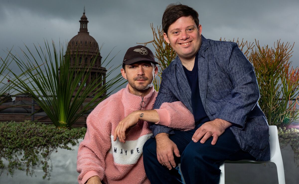 Shia LaBeouf, left, and Zack Gottsagen pose on a rooftop during South by Southwest in downtown Austin, Texas, on Sunday. The pair premiered their film, "The Peanut Butter Falcon," at the SXSW Film Festival on Saturday.