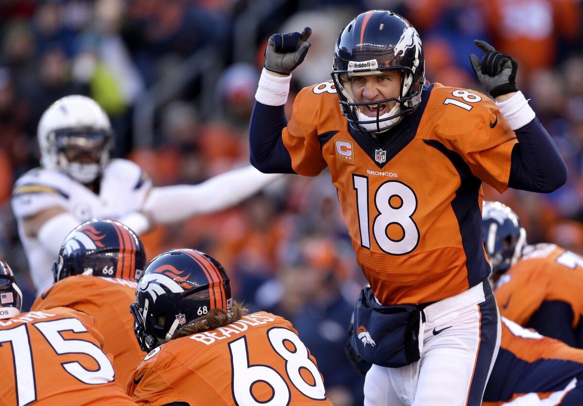 Denver Broncos quarterback Peyton Manning calls an audible at the line of scrimmage during a playoff game against the San Diego Chargers last season.