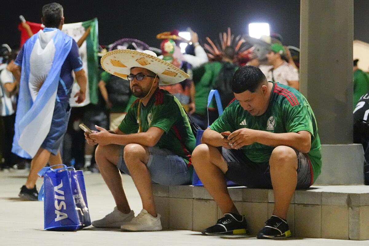 Mexico supporters sit outside  