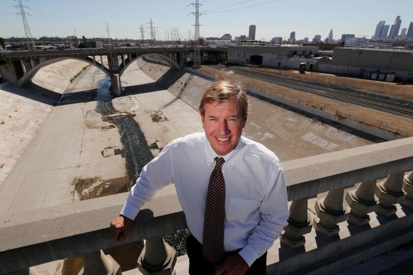LOS ANGELES, CALIF. --THURSDAY, OCT. 26, 2017: Mark Hanna, a hydrologist and Senior Principal Water Resources Engineer, helped design the $10-million project by Metabolic Studios which plans to install a giant water wheel and rubber dam on the Los Angeles River near downtown Los Angeles. The currents of revitalization in the Los Angeles River are evident at a downtown section of the concrete channel where an art studio plans to install a giant inflatable dam. A 70-foot water wheel will draw water detained by the dam, raising 80 gallons per minute to create a stream landscaped with native plants and trees near Los Angeles State Historic Park and just north of the cityâs flashy skyscrapers. A final permit to construct the dam is expected from the U.S. Army Corps of Engineers by yearâs end. The dam will be the first amenity constructed along the 51-mile-long river since the late 1930s, when it was transformed into a flood-control channel and escape valve for treated urban wastewater. It will also serve as a template for at least 17 other proposals for installing such dams to capture the river's treated wastewater and create expanses of water for storage, recreational purposes and economic development. (Allen J. Schaben / Los Angeles Times)
