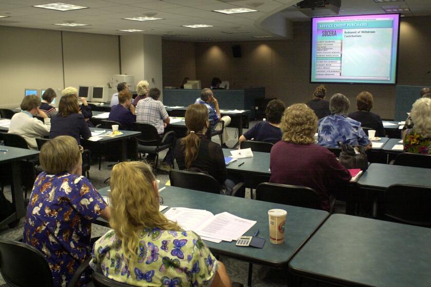 County employees watched a presentation at the San Diego County Employees Retirement Association office downtown during a meeting to discuss retirement benefits.