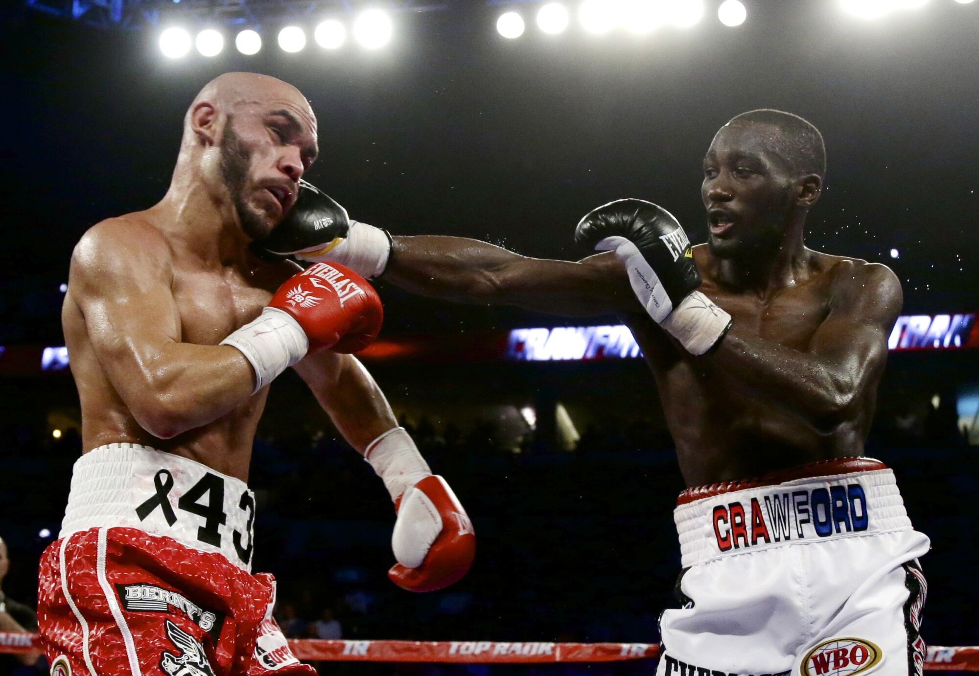Terence Crawford lands a right on Raymundo Beltran during a WBO lightweight title boxing bout 
