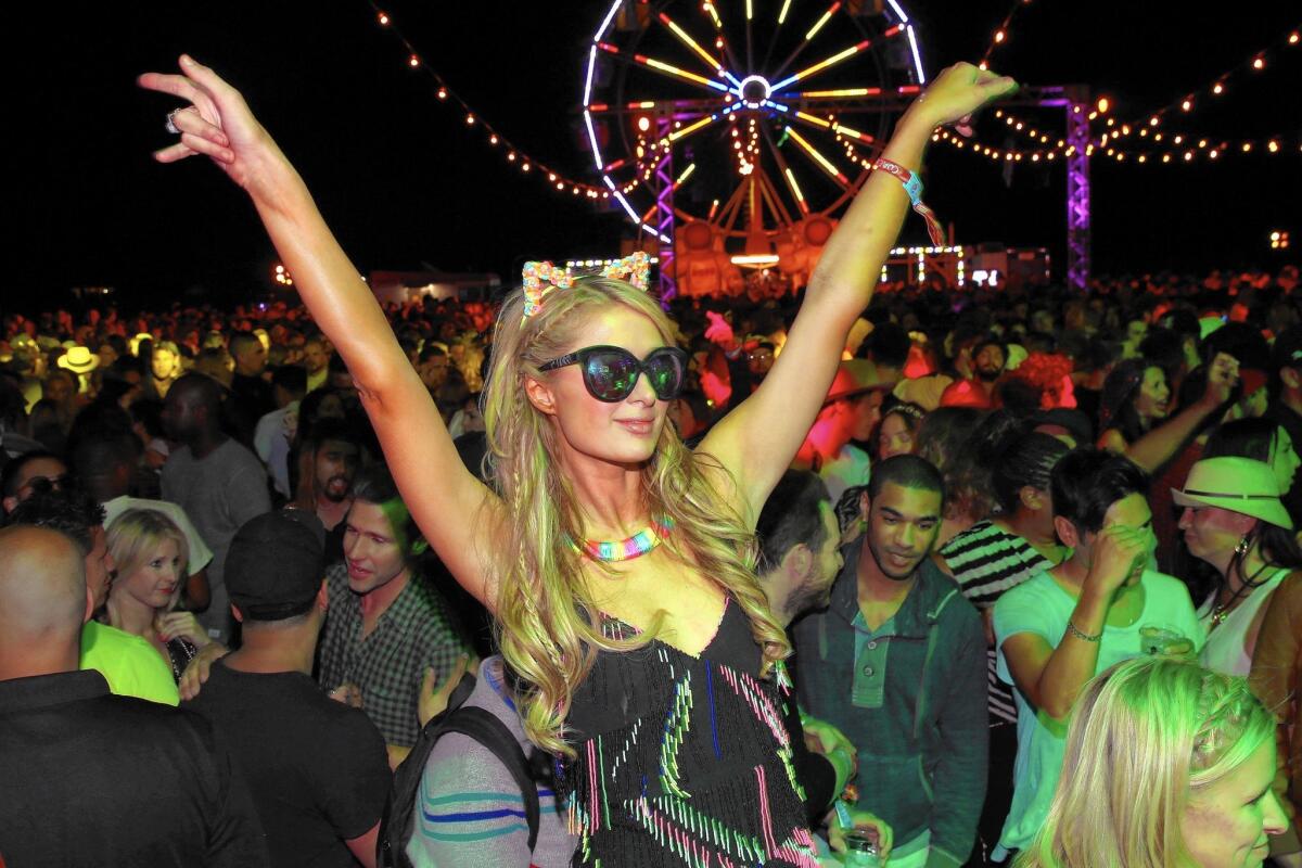 Paris Hilton at this month's Neon Carnival in Thermal, Calif. Her lawyer, Robert Tucker, described the purchase of ParisHilton.porn as a defensive measure.
