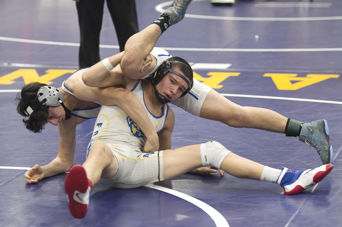Fountain Valley's Dylan Zotea, makes a move on his opponent in the 126-lb, third place medal match, in the Five Counties Invitational wrestling tournament at Fountain Valley High on Saturday.