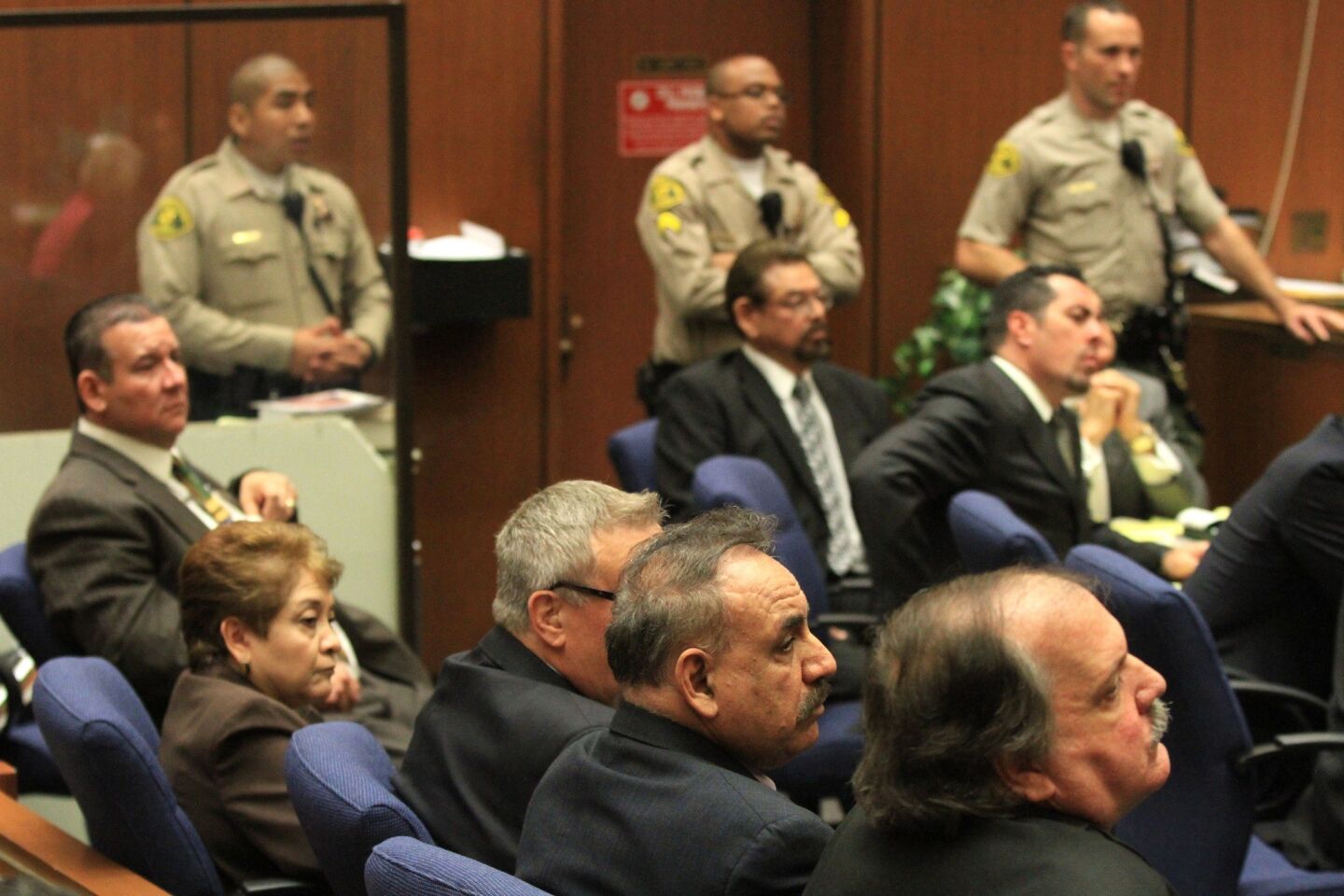 Five former Bell City Council members were found guilty March 20, 2013 of stealing public money by paying themselves extraordinary salaries in one of Los Angeles County's poorest cities. From lower right are Victor Bello, Oscar Hernandez, George Cole, Teresa Jacobo, Luis Artiga and George Mirabal. Luis Artiga, the only one of the six defendants who was acquitted on all charges, was released by the judge.