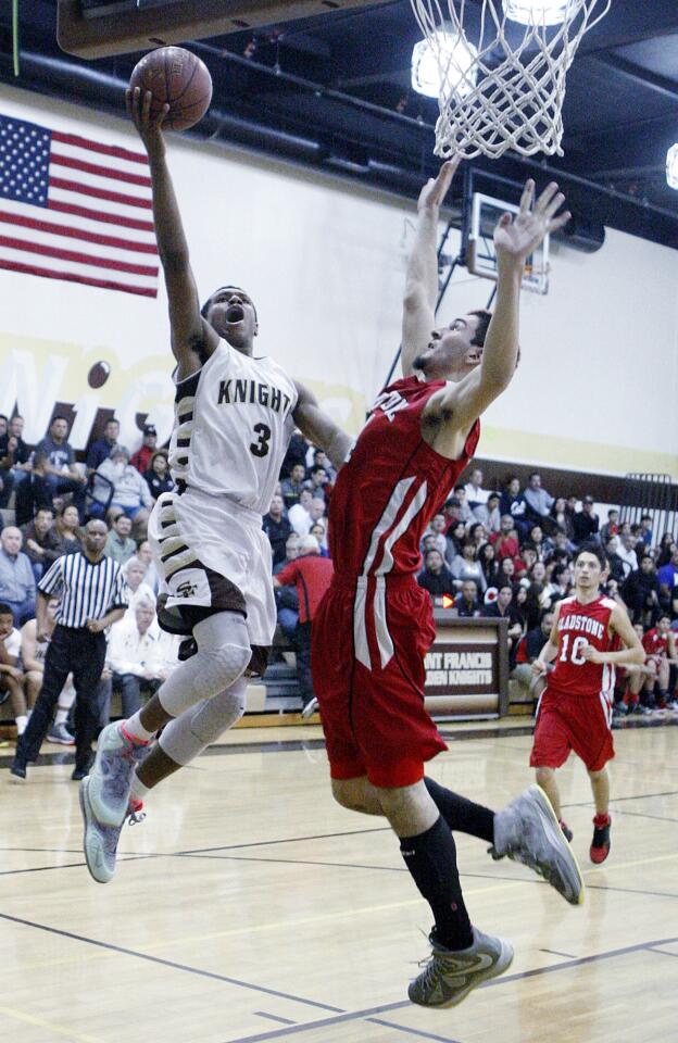 St. Francis' Kyle Leufroy drives and shoots against Gladstone's Eddie Servin in a CIF quarterfinal boys basketball game at St. Francis High School in La Canada Flintridge on Tuesday, February 25, 2014.