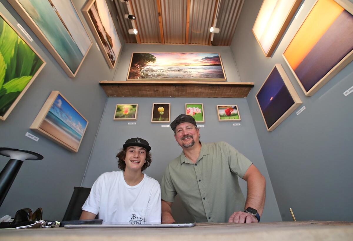 First-year photography exhibitor Steve Lerum in his booth at the Sawdust Art Festival in Laguna Beach on Thursday.