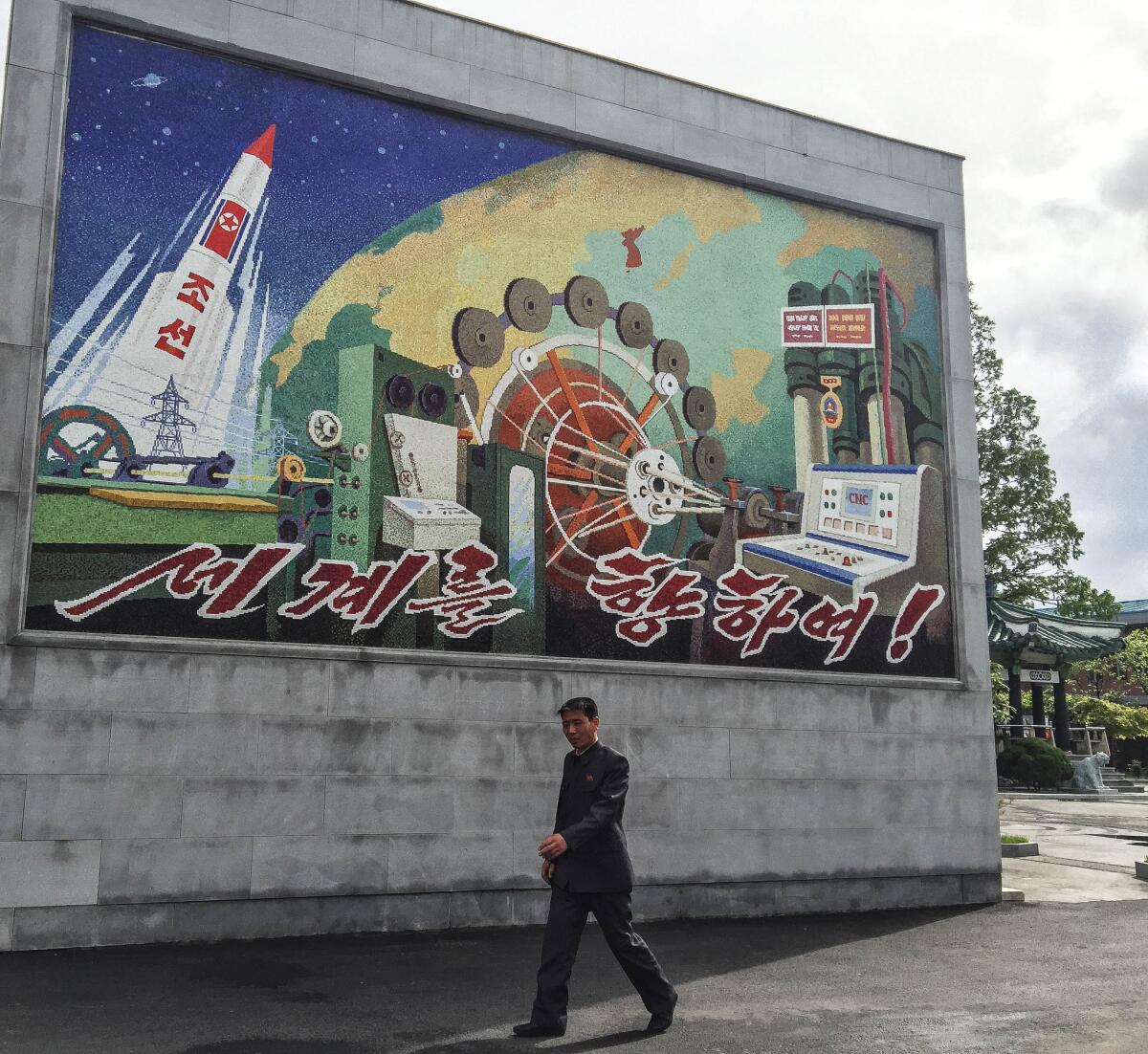 A mosaic outside the factory showcases North Korea’s rocket technology and industrial prowess. It says “Towards the world!” (Julie Makinen / Los Angeles Times)