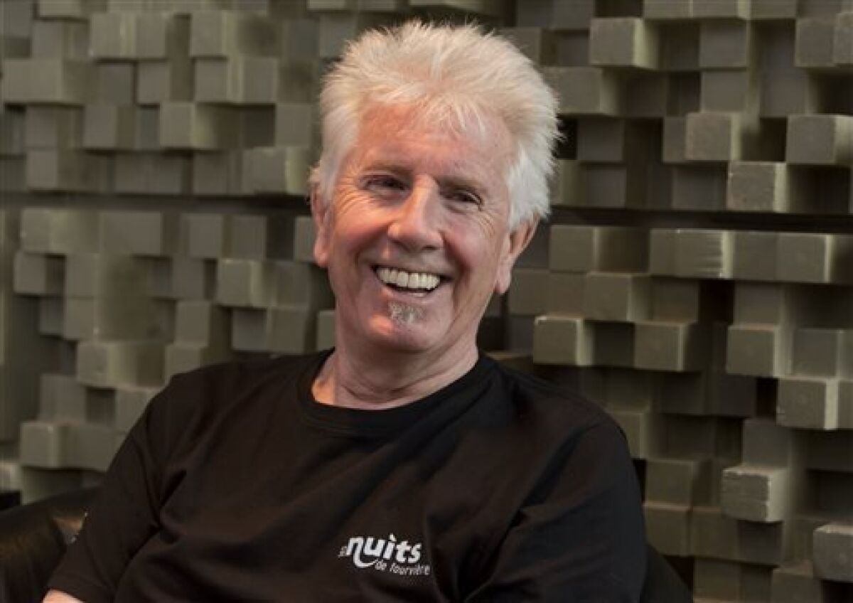 Singer Graham Nash is interviewed during a break in the recording session for the audio book version of his "Wild Tales: A Rock & Roll Life" autobiography, in New York, Thursday, July 25, 2013. (AP Photo/Richard Drew)
