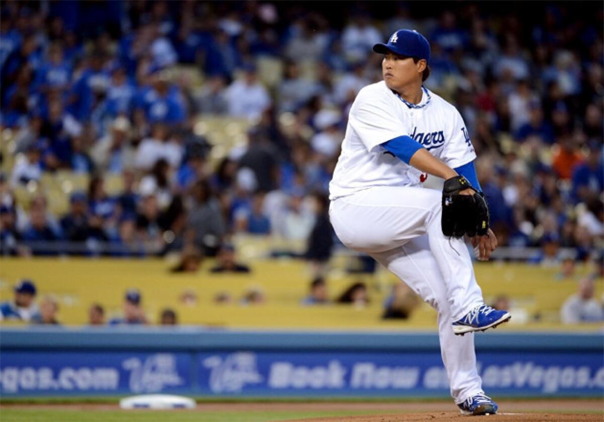 Dodgers pitcher Hyun-Jin Ryu throws during his MLB debut against the San Francisco Giants.