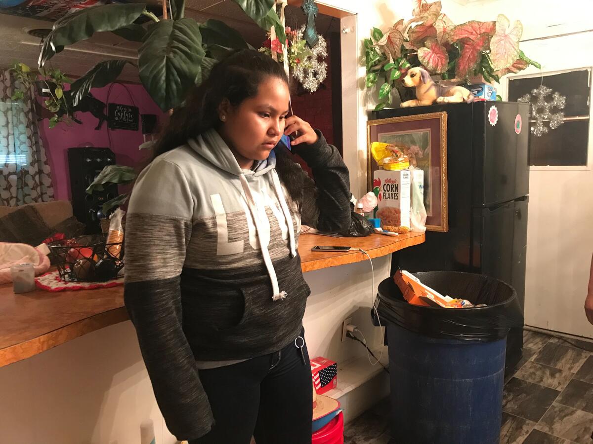 Juana Andres, 12, waits for news of her mother and father.