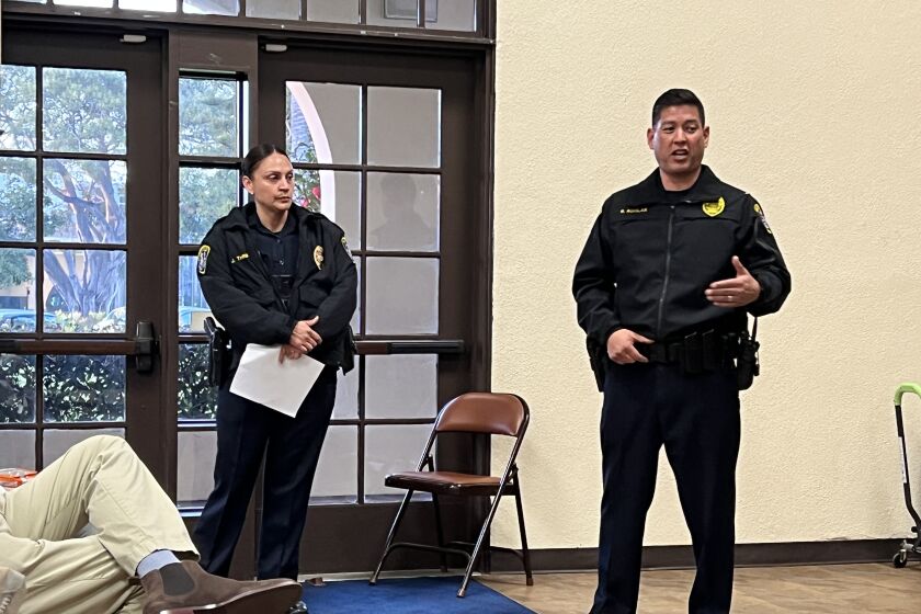 SDPD Lt. Rick Aguilar, right, and Jessica Thrift update the La Jolla Town Council on a recent burglary series March 10.