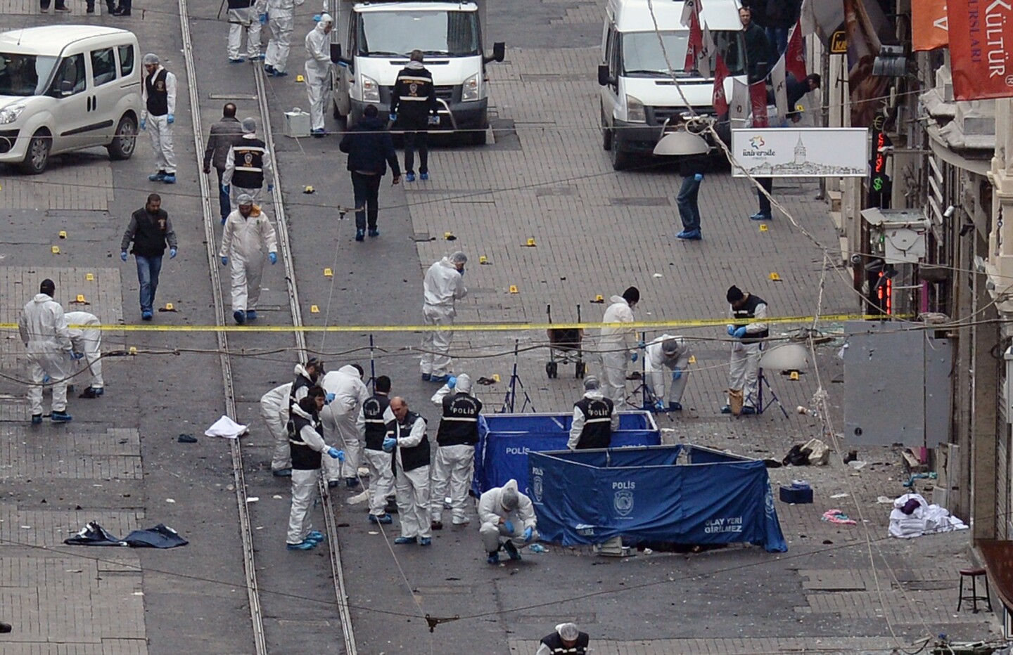A forensic team works at the scene of the Istanbul explosion.