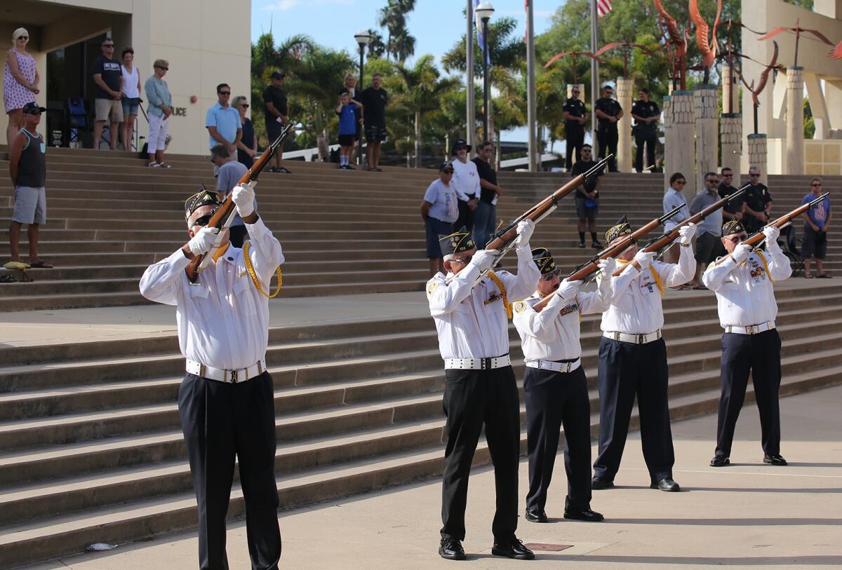 A three volley rifle salute Sunday was part of a 9/11 Patriot Day ceremony outside Huntington Beach City Hall.