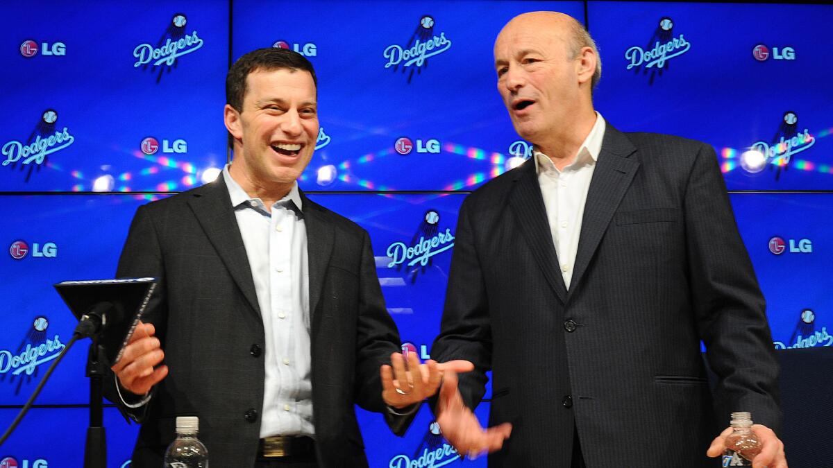 Andrew Friedman, the Dodgers' president of baseball operations, left, speaks with team President and CEO Stan Kasten during a news conference at Dodger Stadium on Oct. 17.