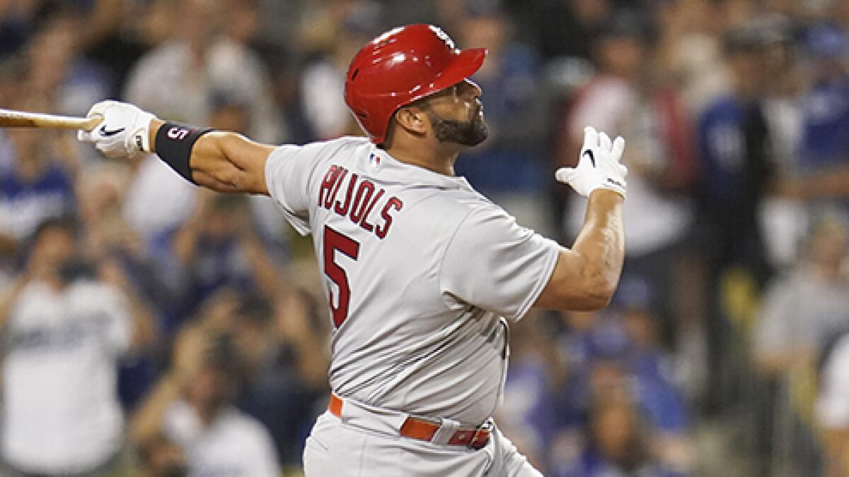 Pujols hit in 10th, Dodgers beat Rox, stay close in NL West - The San Diego  Union-Tribune