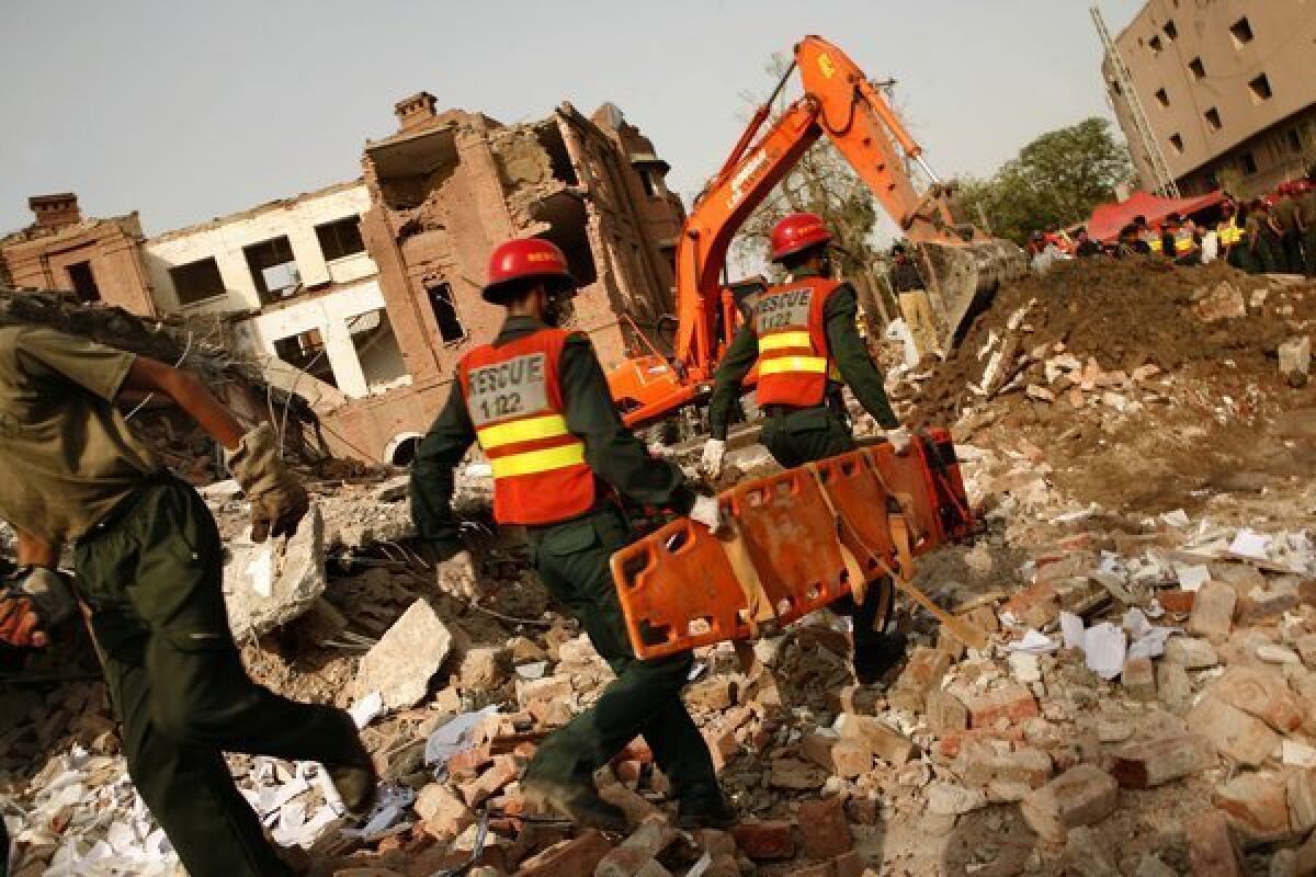 Rescuers look for victims of a suicide bombing in Lahore, Pakistan, in 2009. Authorities say a man from Portland, Ore., provided support to one of the three bombers.