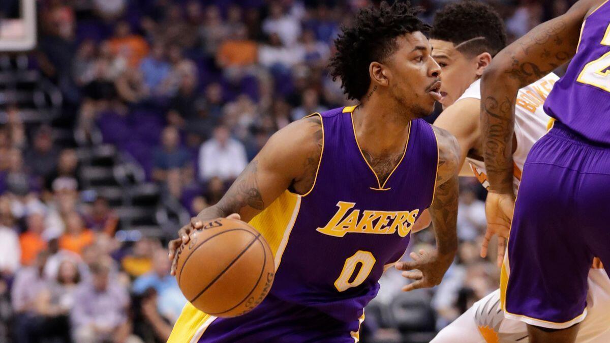 Lakers guard Nick Young drives against the Phoenix Suns during the first half on Thursday.