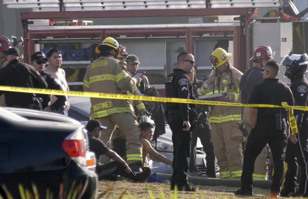 Fire Department personnel responded to a plane crash into a building near the Fullerton Airport on Thursday.