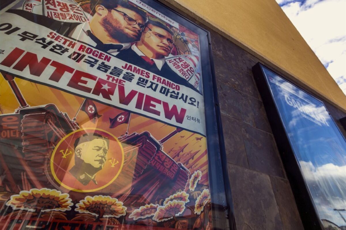 A poster for the movie "The Interview" is displayed outside the AMC Glendora 12 movie theater on Wednesday. Sony Pictures announced Wednesday it was cancelling the movie's Christmas Day release.