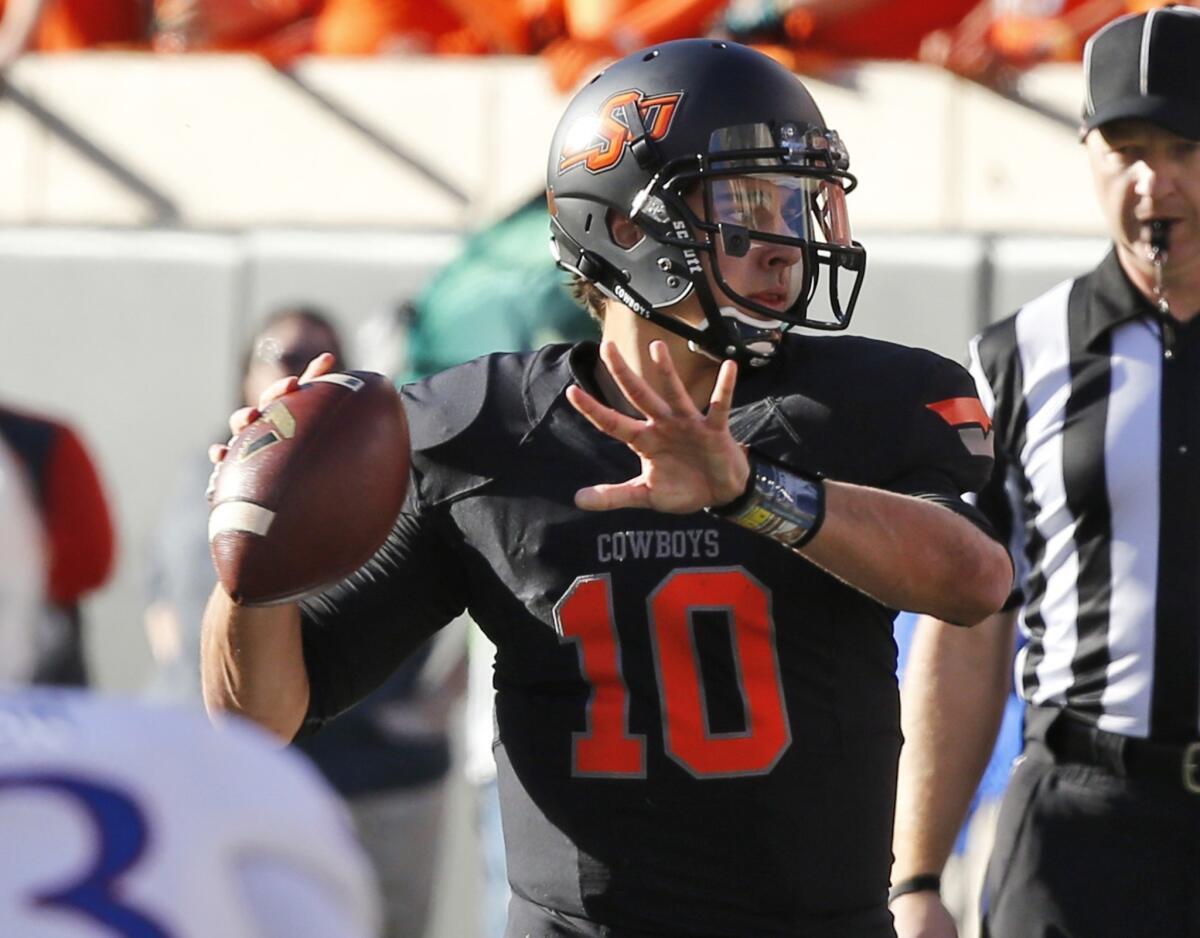 Quarterback Clint Chelf will look to lead Oklahoma State past a competitive Texas team on Saturday.