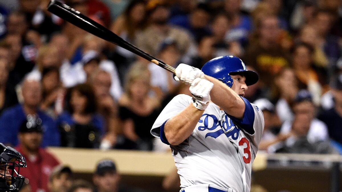 Dodgers rookie right fielder Scott Schebler connects for a solo home run against the Padres in the second inning Friday night in San Diego.