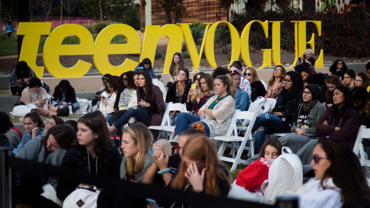 Attendees listen during an outdoor workshop.