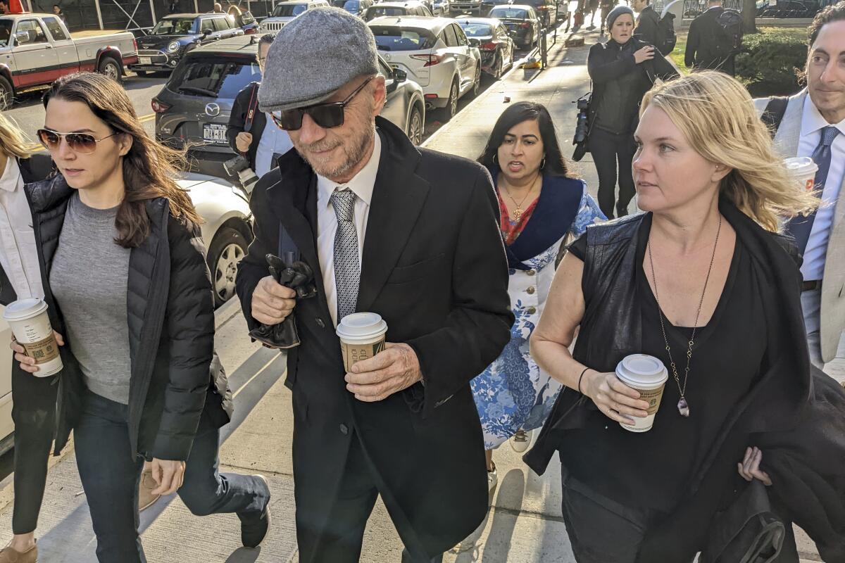 Film director Paul Haggis, center, arrives at court on Oct. 19 in the Manhattan borough of New York. 