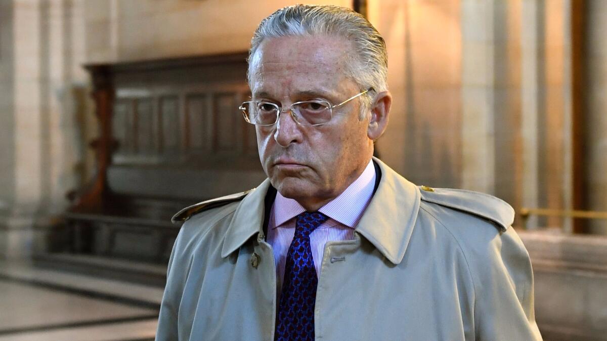 Art dealer Guy Wildenstein arrives for his tax fraud trial at a courthouse in Paris in late September.