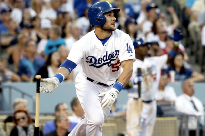Dodgers left fielder Skip Schumaker watches his two-run home run head toward the center-field wall in the fifth inning Saturday night at Dodger Stadium.