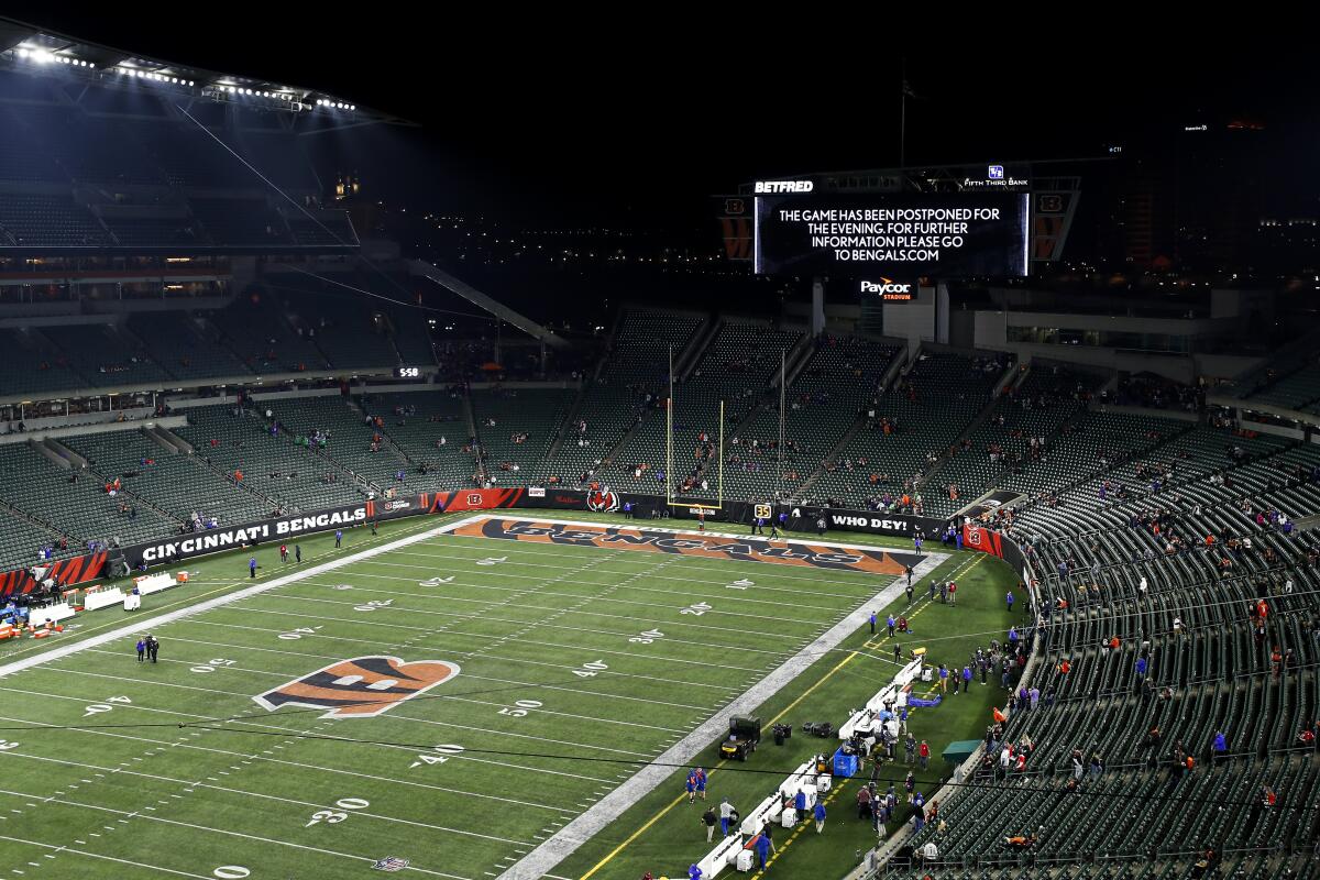 A video board says the game between the Bills and the Bengals was suspended because an injury sustained by Damar Hamlin.