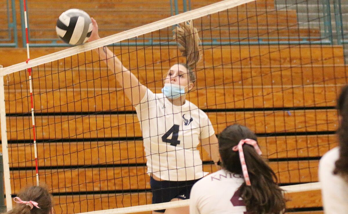 Outside hitter Eva Rohrbach hits a sharp angle for one of her six kills.