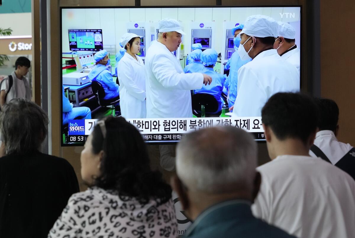 A TV screen shows a file image of North Korean leader Kim Jong Un during a news program at a railway station in Seoul.