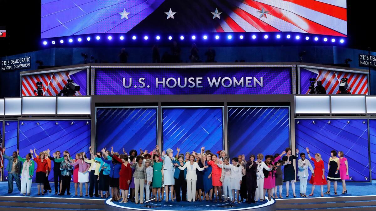 House Minority Leader Nancy Pelosi of California stands amid Democratic women house members during the second day of the Democratic National Convention in Philadelphia.