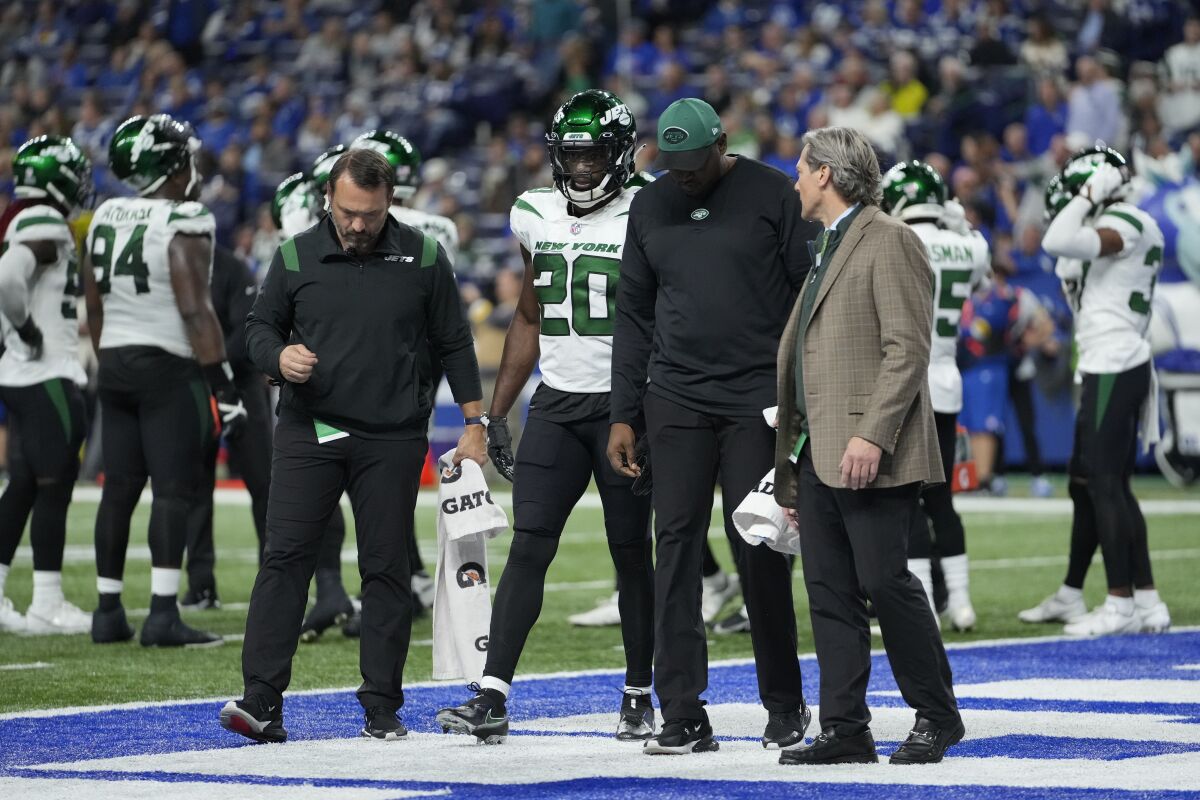 New York Jets' Marcus Maye (20) is helped off the field during the second half of an NFL football game against the Indianapolis Colts, Thursday, Nov. 4, 2021, in Indianapolis. Maye will miss the rest of the season with a torn Achilles tendon. Tests confirmed the severity of the injury, which coach Robert Saleh announced Friday. (AP Photo/AJ Mast)