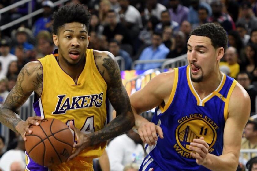 Laker rookie guard Brandon Ingram drives against Warriors guard Klay Thompson during a game on Oct. 15.